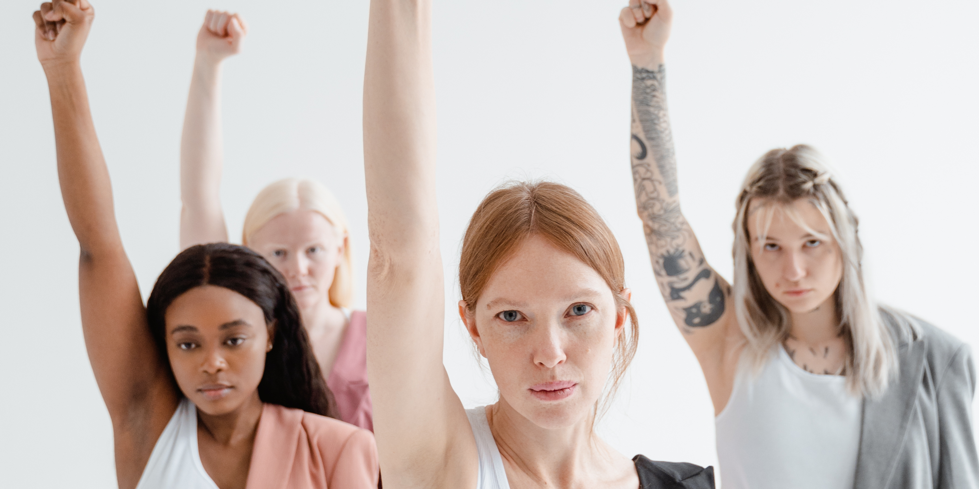 Confident woman raising her arms, symbolizing reproductive autonomy and exploring financing options for egg freezing with Fyrce Care
