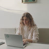 Video of a woman sitting at her laptop, emphasizing the benefit of egg freezing to align family planning with personal and career goals, Fyrce Care.