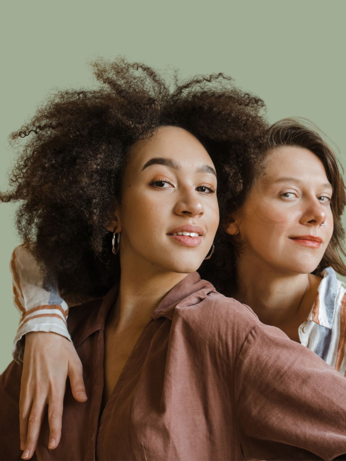 Two women smiling confidently, symbolizing empowerment and reproductive choice, featured on the homepage of Fyrce Care.